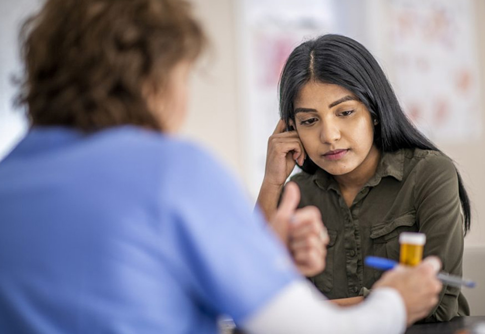 Pharmacist talking to patient about medication